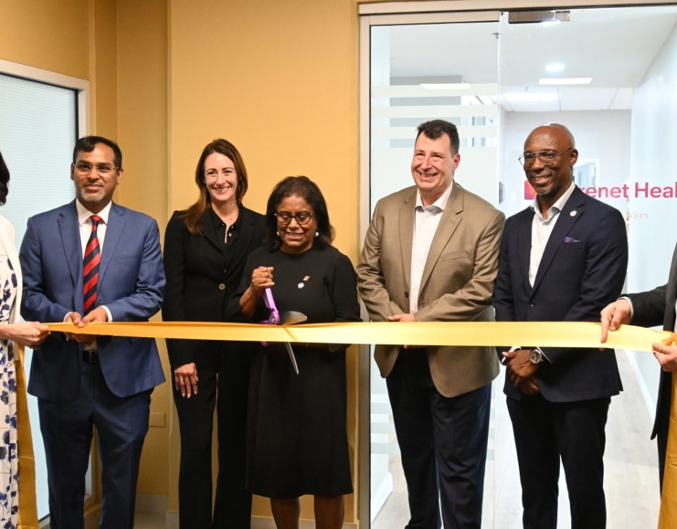 Minister Gopee-Scoon cuts ribbon at the opening of Carenet Health TT's office at Albion Plaza, Port of Spain